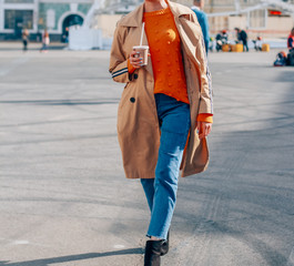 woman drinking coffee in the city, close-up