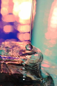dripping water with ripples and bokeh