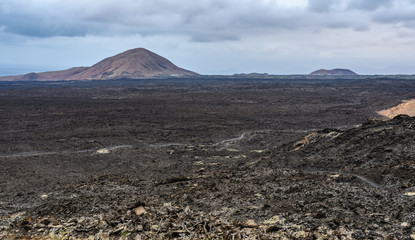 Volcanoes on the horizon in Timanfaya National Park, Lanzarote, Spain