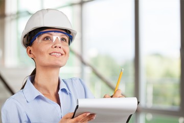 Portrait of young student of architecture  on background