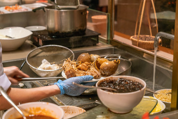 Close up photo of chef cooking seafood in the kitchen