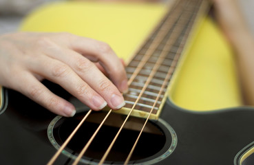 Woman holding an acoustic bass guitar