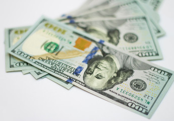 Stacks of paper 100 dollars USA on the white background