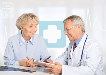Fototapeta premium Female senior patient visiting a doctor at the medical office