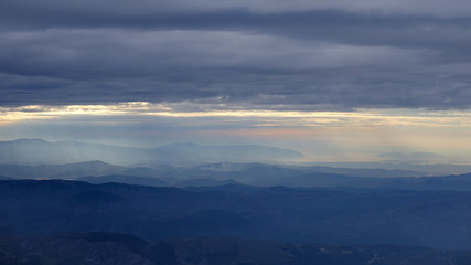 View from Mount Tomorr, Albania, cloudy sky, rays of sunlight