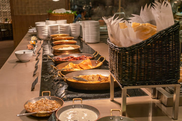 Buffet line with many kind of food in the luxury hotel
