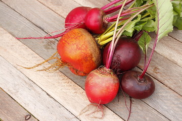Three different beet varieties. A bunch of whole root vegetables.