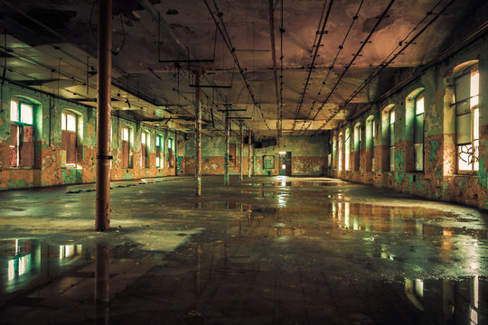 Dark interior inside abandoned old factory building 