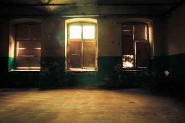 Fototapeta na wymiar Dark interior inside abandoned old factory building 