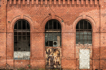 Żyrardów, Poland. Window with iron frame and red bricks wall of old factory. © Ralfik D
