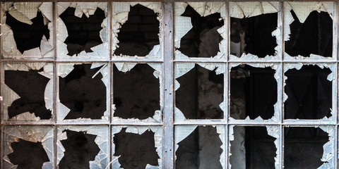 Broken glass in iron frame window
