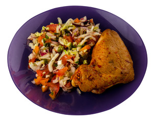 chicken wing with vegetable salad on a plate. chicken wing with vegetable salad isolated on white...