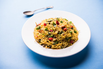 Spicy semiya uppma or upma served in plate. selective focus