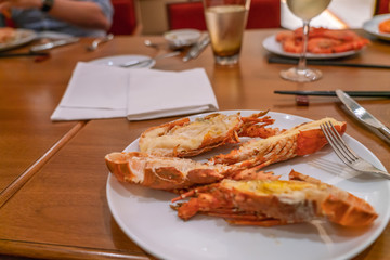 White plate with Grilled Lobsters on table in the restaurant