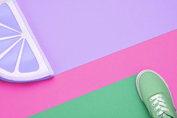 Fashion Woman Trendy Trainers. Stylish Hipster Set. Bright Green Purple Color. Minimal concept. Summer Sneakers, fashionble Handbag Clutch. Flat lay. Spring Girl. Art Design