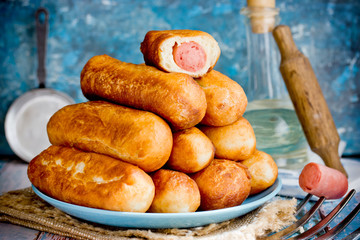 Sausage rolls, pastry wrapped sausages, fried meat sausages in blankets, sausage pies in dough © san_ta