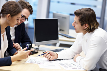 Adult couple in the office with real estate agent