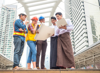 Group of engineer and  burmese businessman meeting and discussion their project work