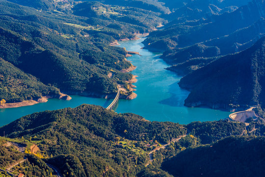Mountains landscape with the blue waters of Baells Reservoir in the valley, Catalonia, Spain.