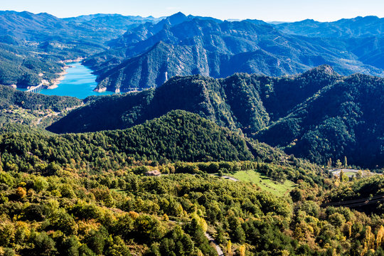 Mountains landscape with the blue waters of Baells Reservoir in the valley, Catalonia, Spain.