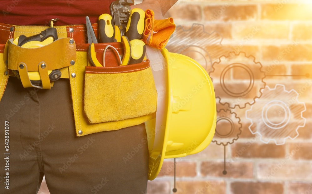 Wall mural worker with a tool belt. isolated over white background.