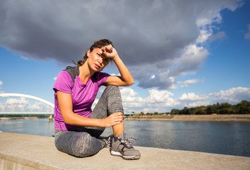 Fitness woman tired resting