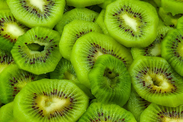 Background, delicious, fresh, ripe, sliced kiwi, closeup.