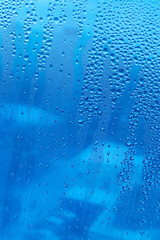 Naklejka na ściany i meble Water drops on glass