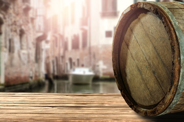wooden barrel as a table with a free space for an advertising product, the hero on the background of the landscape  