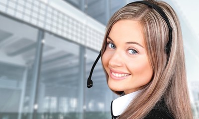 Close-up view of young woman face with headphones, call center