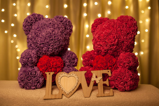 bear of flowers with heart at bright background
