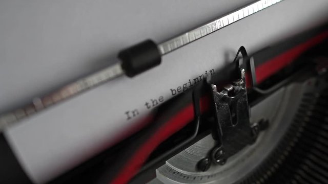 Typewriter spelling out "In the beginning was the word".