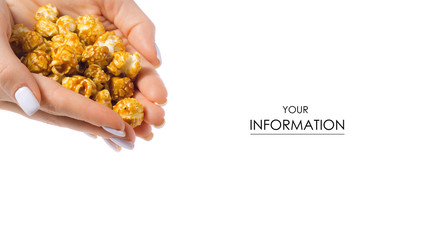 Obraz premium Caramel popcorn in hand pattern on a white background, top view
