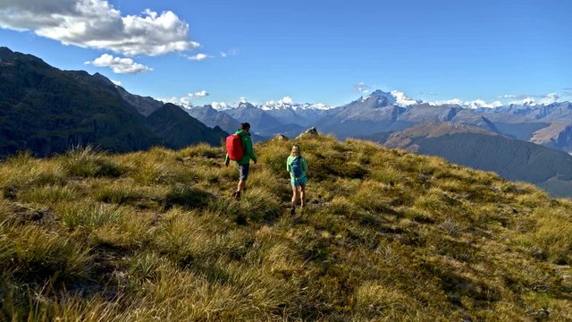Aerial couple trekking Fjordland National Park New Zealand