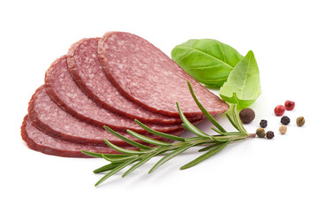 Tasty Salami Sausage with herbs and spices, close-up, isolated on a white background
