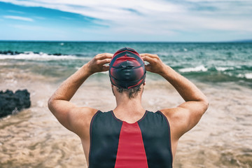 Triathlon swim sport man on race . Swimmer getting ready for open ocean competition. Triathlete...
