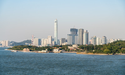Fototapeta premium Cruising past the island of Gulangyu in foreground with background of Xiamen in China