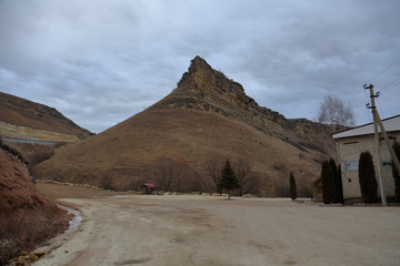 The slopes of the hills in the autumn day in cloudy weather
