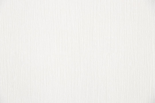 The texture of the light canvas fabric as a background. Gauze texture. Close-up.