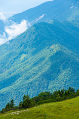 Dramatic and majestic clouds on Slovenia mountains. Clouds above the big mountain in summer...