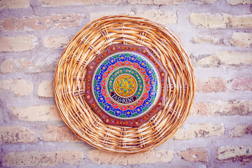 wicker plate on the wall