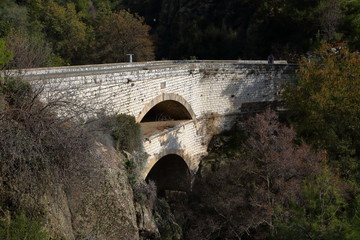 Fototapeta na wymiar old unique double stone bridge over the river, Cyprus