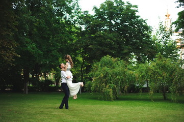Romantic wedding moment, couple of newlyweds smiling portrait, bride and groom hug.