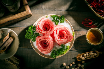 Fresh beef slices in the shape of a rose