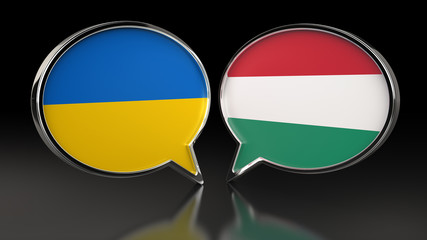 Ukraine and Hungary flags with Speech Bubbles. 3D illustration