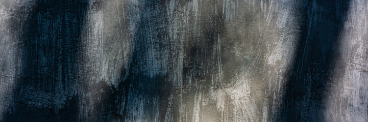 surface of the wall with old cement plaster covered with stains and cracks, stained. Web banner.