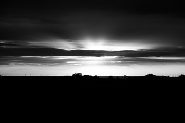 Bursting clouds above a skyline.