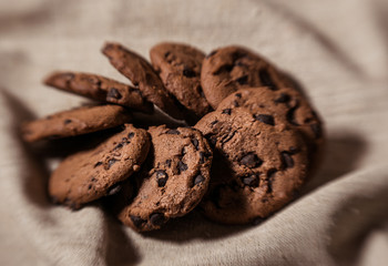 Festive chocolate cookies on linen fabric background