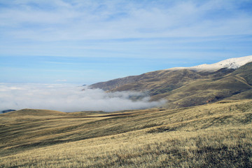 Autumn landscape, fields and meadows, snow-capped mountains and hills of Armenia.