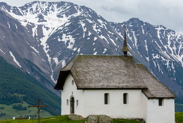 Fototapeta na wymiar Small Church in Bettmeralp, Alps, Switzerland